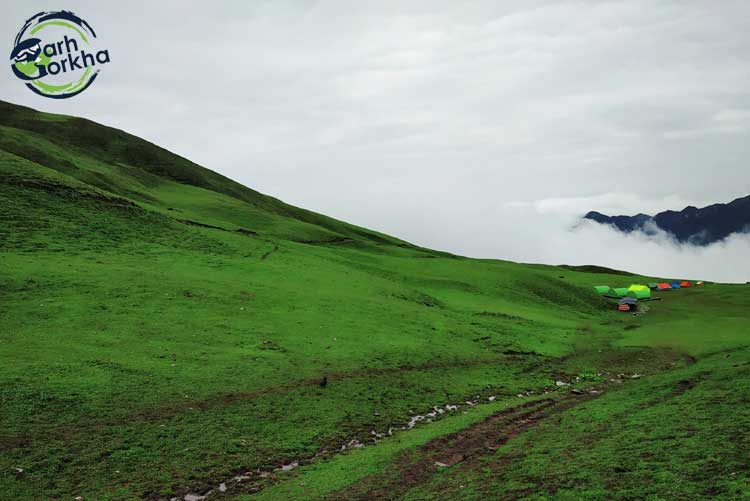 Captivating green sprawl of bedini bugyal with the glimpse of mt. Trishul from our first campsite